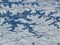 Aerial winter snow landscape view of rural and city land between Minneapolis Minnesota and Indianapolis Indiana with stark contras