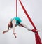 Aerial, woman gymnast and sport performance with stretching, flexibility and athlete with white background. Workout