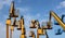 Aerial work platform of cherry pickers on blue cloudy sky background