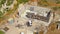 AERIAL: Workers prepare walls for concrete pouring at a house under construction