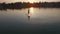 Aerial: young man boarding SUP