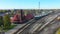 Aerial zoom of Train arriving at Station 4K