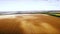 Aero : cloudy sky over golden field of corn - aerial photo