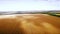 Aero : cloudy sky over golden field of corn - aerial photo