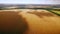 Aero : cloudy sky over golden field of corn - aerial photo