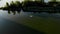 Aero. group of women practicing SUP yoga, they balancing on paddle boards, on water of large river, during summer warm