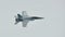 Aerobatic flying display by Royal Australian Air Force (RAAF) F-18 Hornet at Singapore Airshow