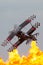 Aerobatic pilot Skip Stewart flying his highly modified Pitts S-2S biplane Prometheus in front of the spectacular wall of fire pyr