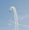 Aerobatic pilots with her colored airplanes training in the blue sky