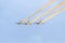 Aerobatic pilots training in the blue sky, airplanes with colored trace smoke