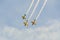 Aerobatic pilots training in the blue sky, airplanes with colored trace smoke