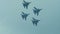 Aerobatics of four jet fighters