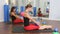 Aerobics pilates women personal trainer with pupil in a row at gym