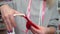 aerodesigner. a woman treats the balloon with gel before inflating.