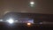 Aeroflot plane gaining speed on runway before taking off at night