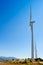 Aerogenerator windmills in a row in blue sky