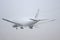 AeroLogic Boeing 777f Cutting Through The Fog Leaving Mist Trails