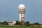 Aeronautical meteorological observations station tower with spherical radar antenna.