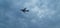 Aeroplane flying in cloudy sky