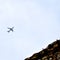 Aeroplane flying in the cloudy sky during the day time near Qutub Minar in Delhi India, Aeroplane flying high in the sky