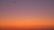 Aeroplane flying in evening sky over desert. Colorful sky in evening desert