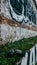 Aerosol spray cans next to wall covered in graffiti writing