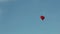 Aerostat heart in the blue sky