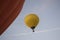 Aerostatic balloon rising up from sky  and birds flying with it