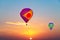 Aerostatic Balloons flying at sunrise
