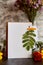 Aesthetic autumn mock up. Crafting empty postcard, stationery card mockup among flowers and leaves. Sustainable, eco