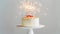 Aesthetic birthday cake with sparklers on pastel beige background. Copy space. Party invitation template. Generative AI