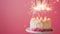 Aesthetic birthday cake with sparklers on pastel pink background. Copy space. Party invitation template. Generative AI