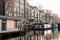 Aesthetic canals of Amsterdam at sunset, view from the water, houseboats on the canal, houseboats hotels. Romantic canal boat ride