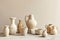 Aesthetic composition of craft hand-made white ceramic products such as vases, jugs, cups in assortments