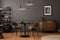 Aesthetic composition of living room interior with mock up poster frame, round black coffee table, wooden sideboard, dark wall