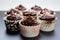 Aesthetic contrast chocolate cakes arranged in a cup on a white background