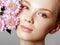 Aesthetic Cosmetology. Spring Woman. Beauty Summer model girl with colorful flowers . Beautiful Lady with Blooming