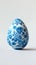 Aesthetic easter egg in traditional blue ethnic painting style. White background. Copy space. Generative AI