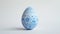 Aesthetic easter egg in traditional blue ethnic painting style. White background. Copy space. Generative AI