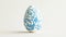 Aesthetic easter egg in traditional blue ethnic painting style. White background. Copy space. Generative AI