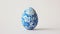 Aesthetic easter egg in traditional blue ethnic painting style. White background. Copy space. Generative AI