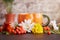 Aesthetic eco-friendly sustainable teatime with cup in creative shape of pumpkin. Autumn background among rowan berries
