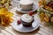 Aesthetic french gluten and sugar free cupcake close up among autumn atmospheric decoration and cup of coffee. Cozy