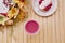 Aesthetic french raspberry tart with healthy pink strawberry smoothie on the wooden table among autumn decorations