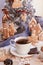 Aesthetic winter breakfast. Ginger cookies of snowflake near Christmas tree. Cozy warm home