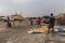 AFAR, ETHIOPIA - MARCH 25, 2019: Locals preparing for tourists in Dodom village under Erta Ale volcano in Afar