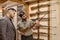 Affable salesman offer firearm to customer
