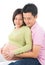 Affectionate Asian pregnant couple