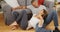 Affectionate black couple talking on floor