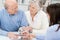 Affectionate elderly couple in a business meeting